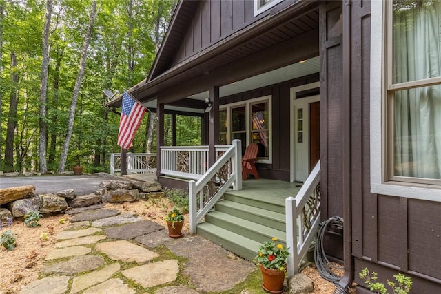 161 Kestrel Ct, Sapphire, NC 28774 - doorway to property with board and batten siding and covered porch