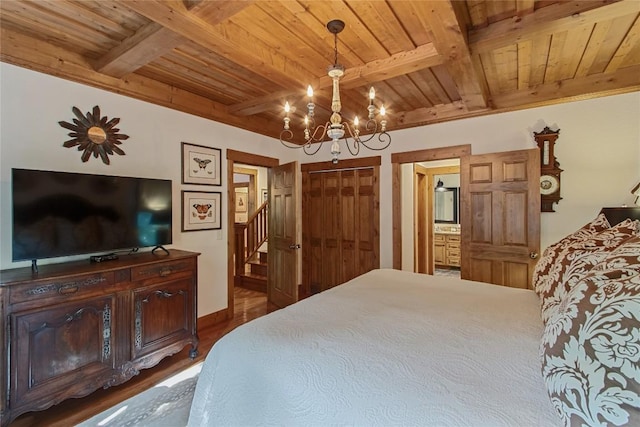 161 Kestrel Ct, Sapphire, NC 28774 - bedroom with a wooden ceiling with exposed beams, a chandelier, dark wood-style flooring, and ensuite bathroom