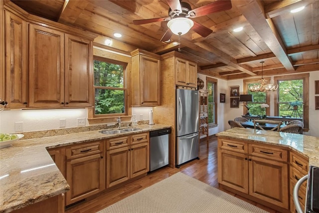 161 Kestrel Ct, Sapphire, NC 28774 - kitchen with appliances with stainless steel finishes, a wood ceiling with exposed beams, light wood finished floors, brown cabinets, and light stone countertops