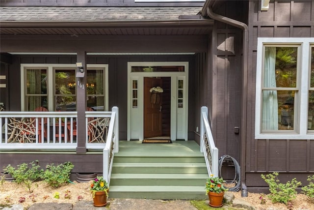 161 Kestrel Ct, Sapphire, NC 28774 - doorway to property featuring a shingled roof and a porch