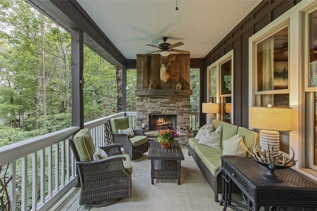 161 Kestrel Ct, Sapphire, NC 28774 - sunroom featuring ceiling fan and an outdoor living space with a fireplace