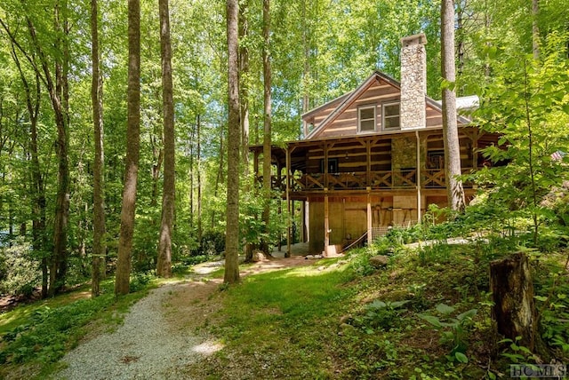 view of yard featuring a wooden deck