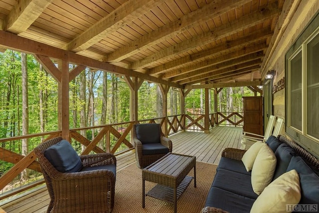 sunroom / solarium with an outdoor hangout area, beam ceiling, and plenty of natural light