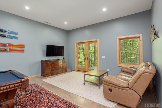 living room featuring french doors and billiards