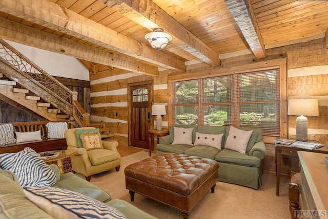 living room featuring wood walls, wooden ceiling, beam ceiling, carpet floors, and stairway