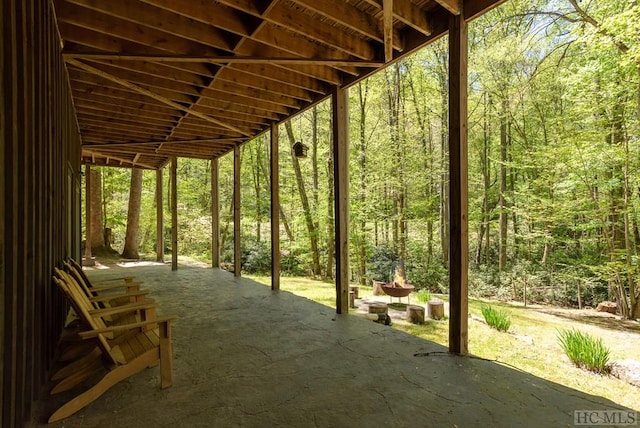 view of patio / terrace featuring a view of trees