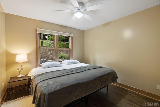 bedroom with ceiling fan and wood-type flooring