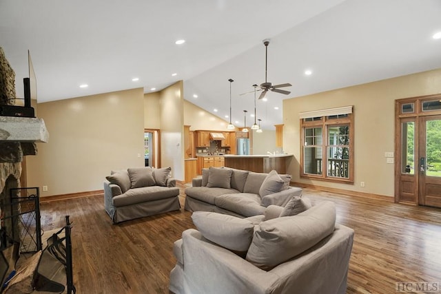 living room featuring a fireplace, high vaulted ceiling, dark hardwood / wood-style flooring, and ceiling fan