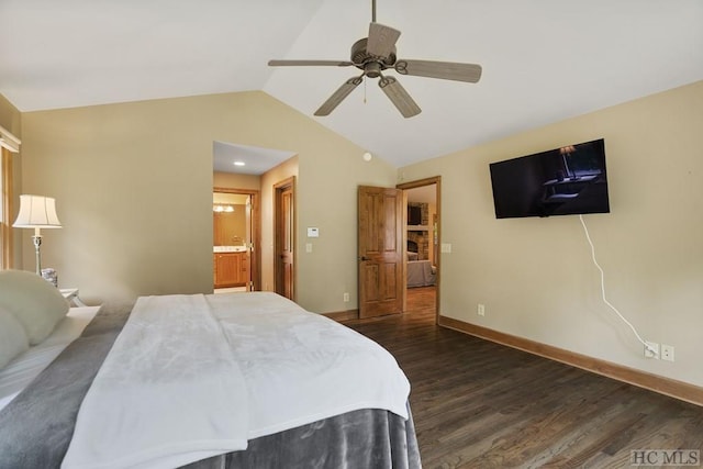 bedroom featuring ensuite bath, ceiling fan, vaulted ceiling, and dark wood-type flooring