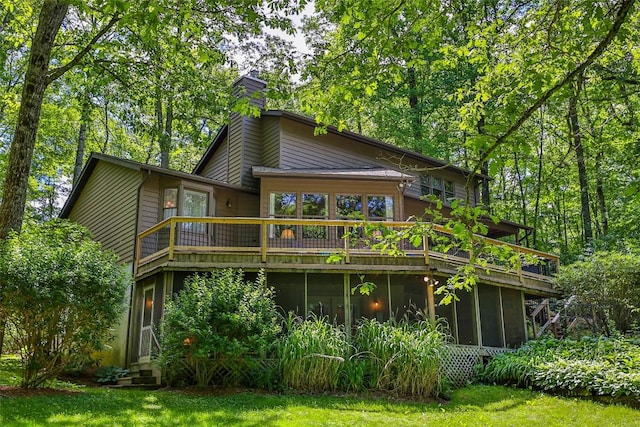 back of house with a sunroom