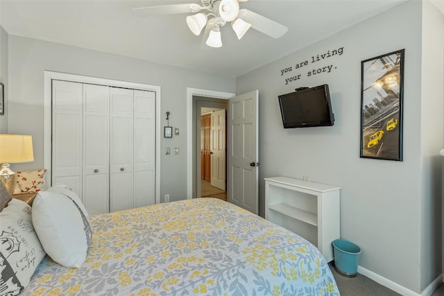 carpeted bedroom featuring ceiling fan and a closet