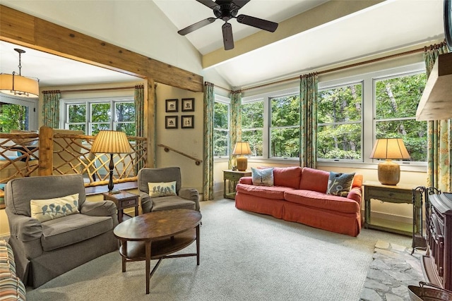 sunroom featuring vaulted ceiling with beams and ceiling fan