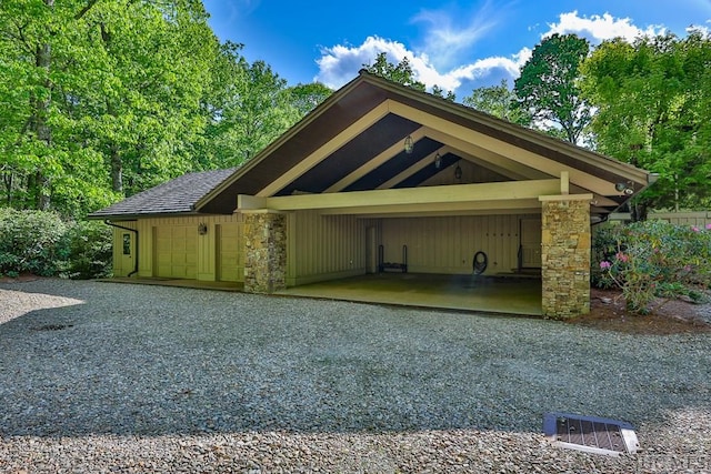 exterior space featuring a carport and a garage