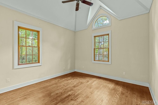 spare room featuring ceiling fan, high vaulted ceiling, hardwood / wood-style floors, and a wealth of natural light