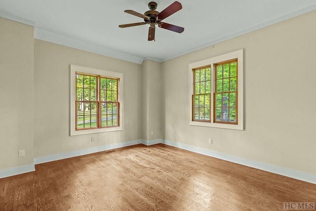 spare room featuring ceiling fan and wood-type flooring