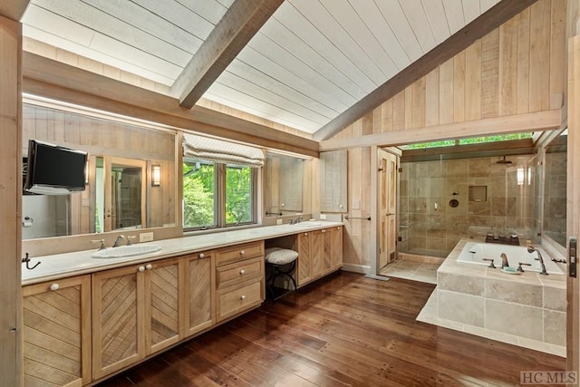 bathroom with vaulted ceiling with beams, wood-type flooring, shower with separate bathtub, wooden ceiling, and vanity