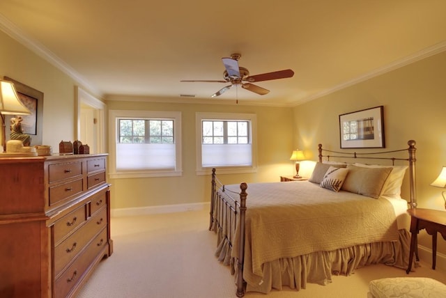 bedroom featuring ornamental molding, a ceiling fan, light colored carpet, and baseboards