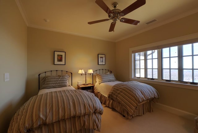 bedroom featuring crown molding, a ceiling fan, visible vents, and light colored carpet