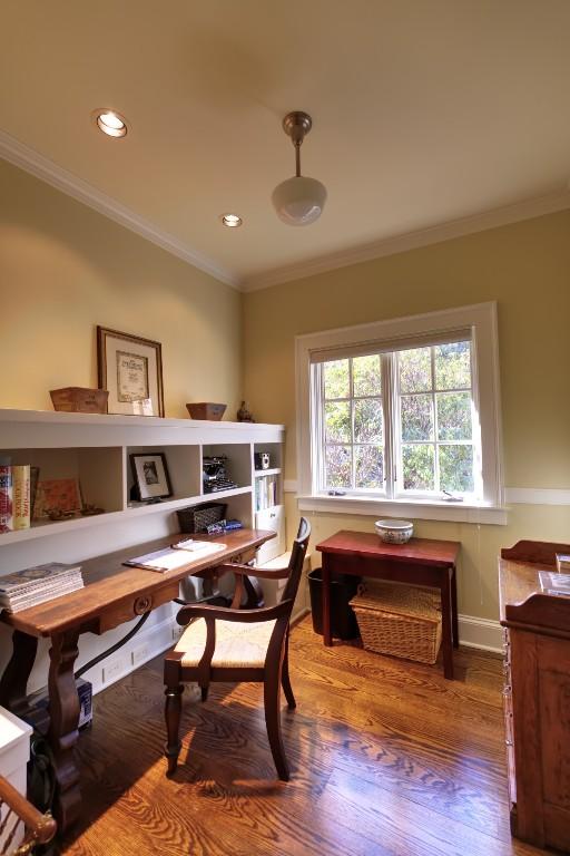 home office featuring baseboards, ornamental molding, wood finished floors, and recessed lighting