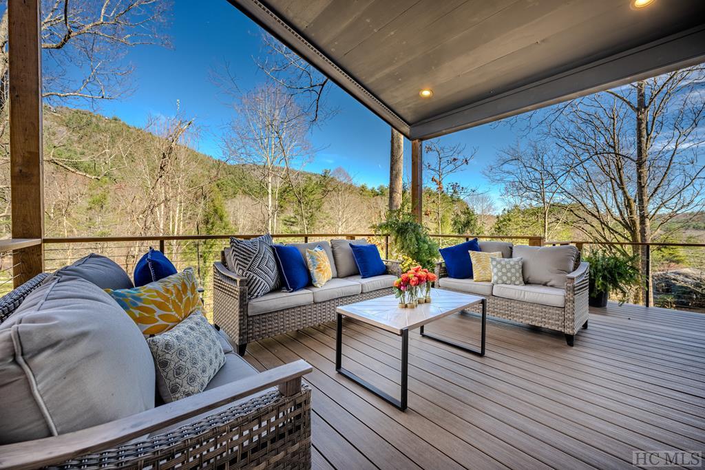 wooden terrace with outdoor lounge area