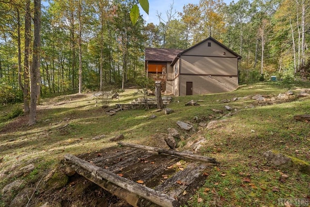 view of outbuilding with a lawn