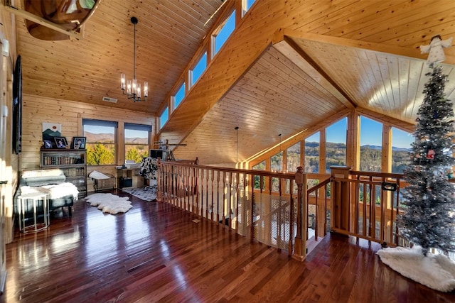 hallway with hardwood / wood-style flooring, a mountain view, high vaulted ceiling, and wood ceiling