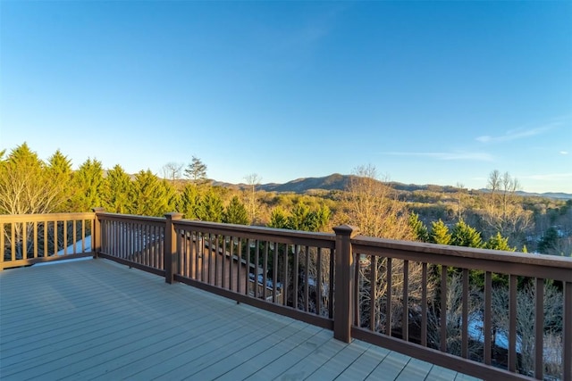 wooden deck with a mountain view