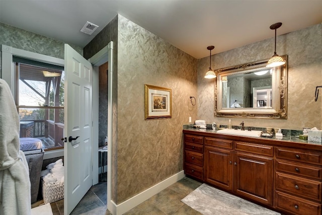 bathroom with vanity and tile patterned flooring