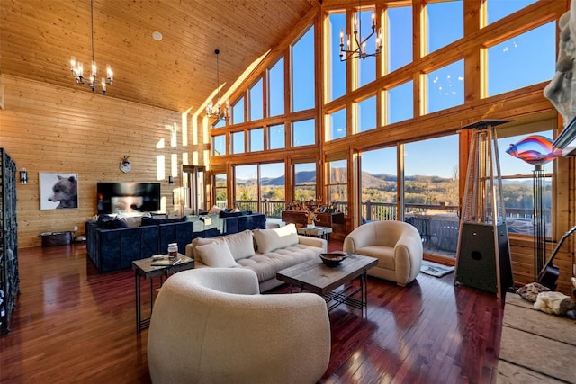 living room featuring wooden ceiling, dark hardwood / wood-style flooring, high vaulted ceiling, and a notable chandelier