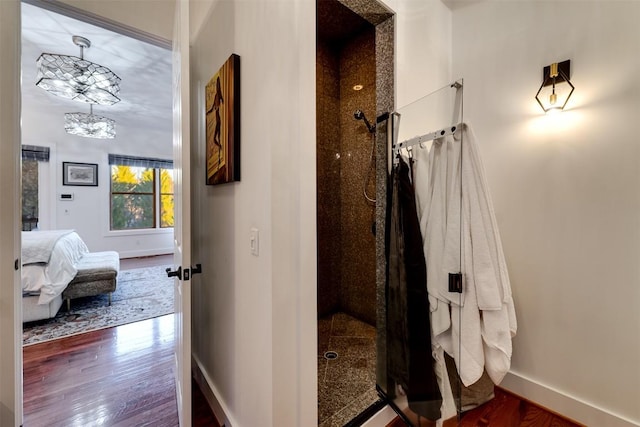 corridor with dark hardwood / wood-style floors