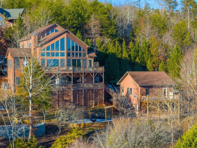 rear view of house featuring a balcony