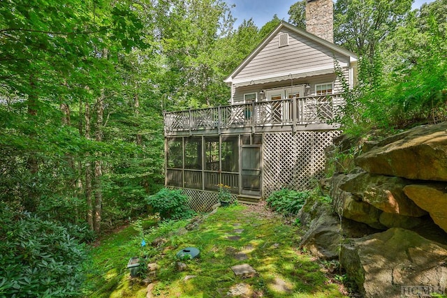 exterior space featuring a sunroom