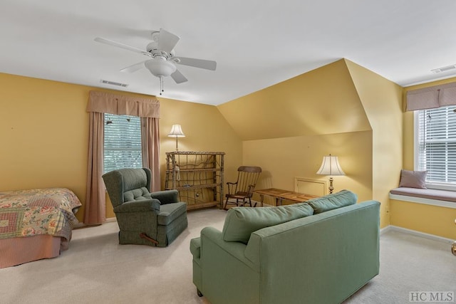 carpeted living room featuring vaulted ceiling and ceiling fan