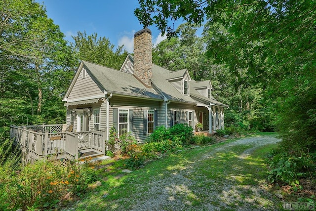 back of house with a lawn