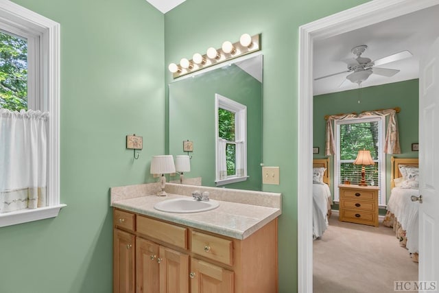 bathroom featuring vanity and ceiling fan