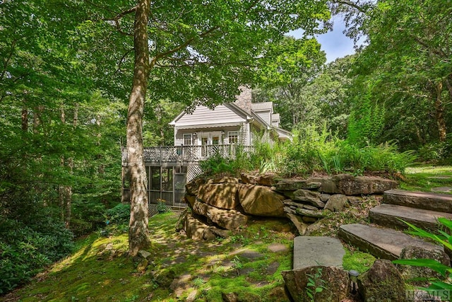 view of yard with a wooden deck