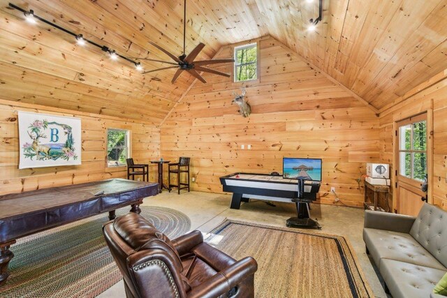 rec room featuring billiards, plenty of natural light, track lighting, wood walls, and wooden ceiling