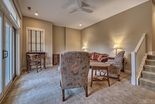 sitting room with light carpet and ceiling fan