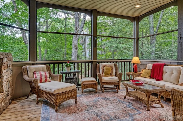 sunroom / solarium featuring wood ceiling