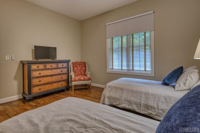 bedroom featuring dark hardwood / wood-style flooring