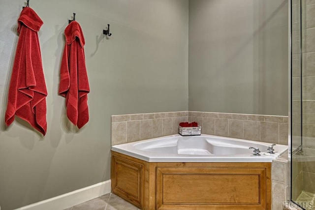 bathroom with tile patterned flooring and plus walk in shower