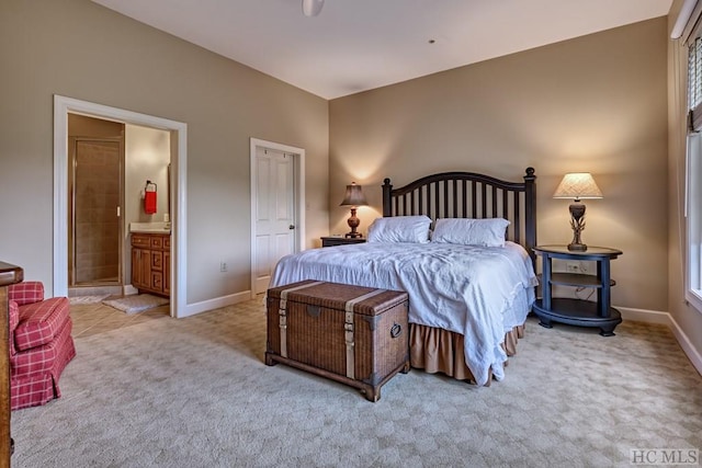 bedroom featuring carpet flooring and connected bathroom