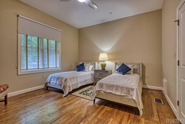 bedroom featuring wood-type flooring and ceiling fan