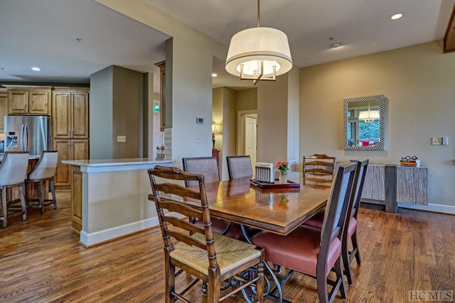 dining area with dark wood-type flooring