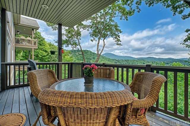 wooden terrace featuring a mountain view