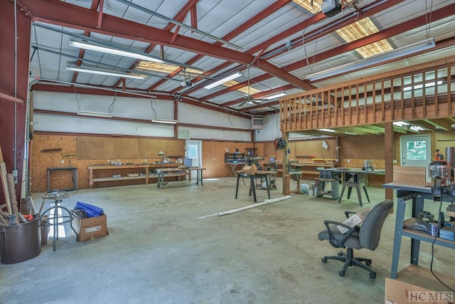 garage with a garage door opener and a workshop area