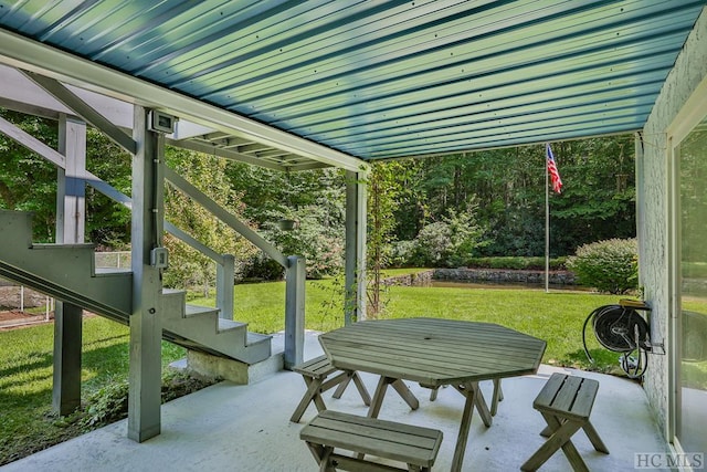 exterior space with outdoor dining space and stairway