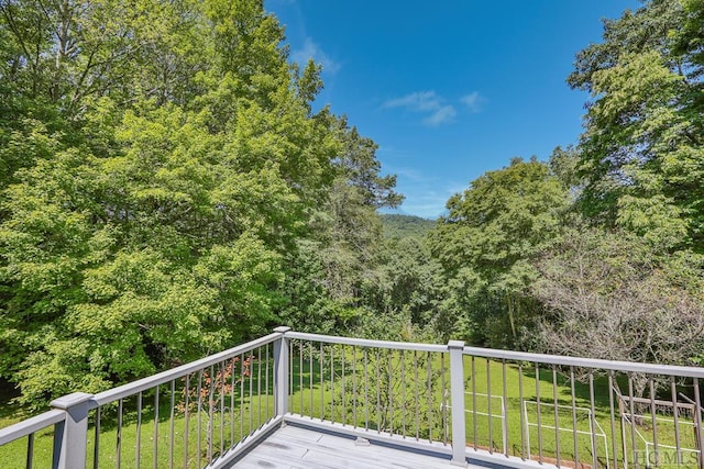 deck featuring a lawn