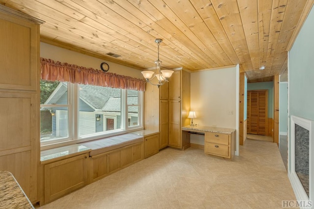 unfurnished bedroom with wooden ceiling, built in study area, visible vents, and an inviting chandelier