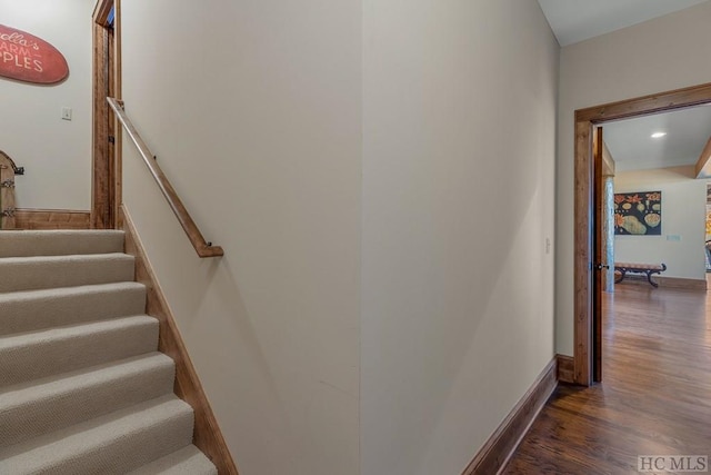 stairs featuring wood-type flooring